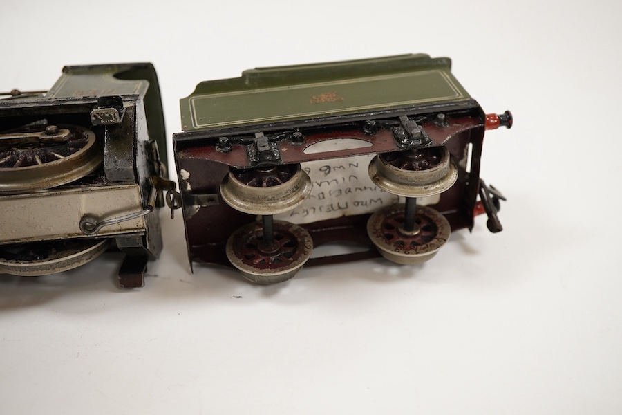 An 0 gauge live steam spirit fired tinplate GWR 4-4-0 tender locomotive, possibly Bing for Bassett-Lowke, 3411, with original fuel tank and burner, two controls in the cab and four wheel tender